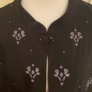 Black evening jacket. Shimmering accents on front. Lightweight. Versatile